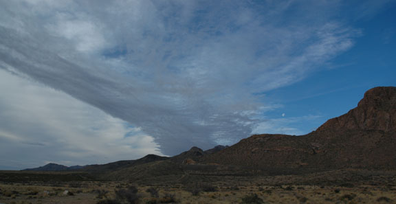 mountains with clouds and moon